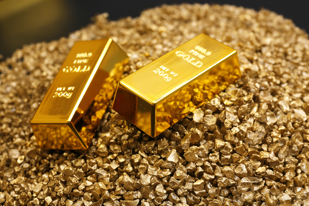 Gold,Bars,On,Nugget,Grains,Background,,Close-up